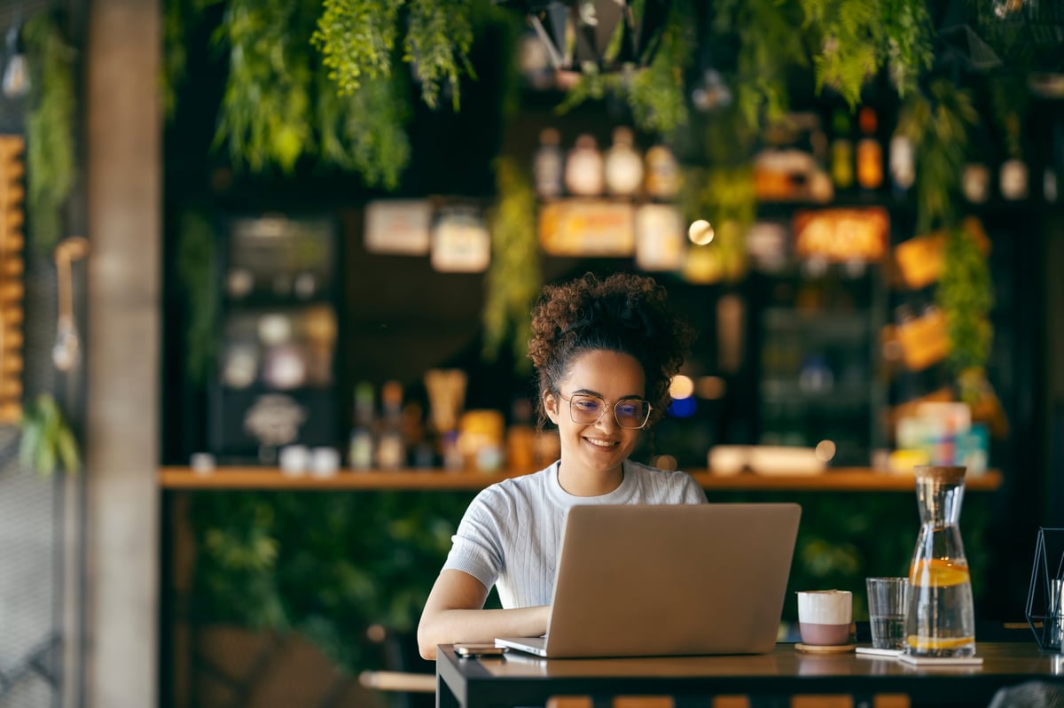 A guest relaxing with coffee at a warm, welcoming café